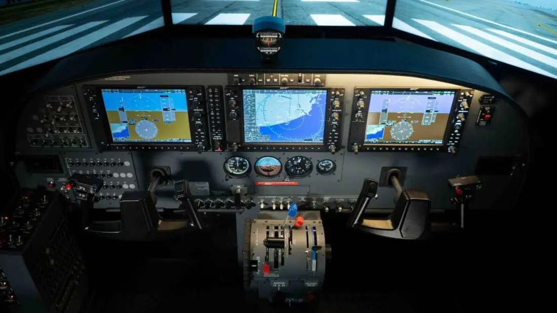 Cessna C208B Caravan flight deck with three G1000 displays and twin yokes
