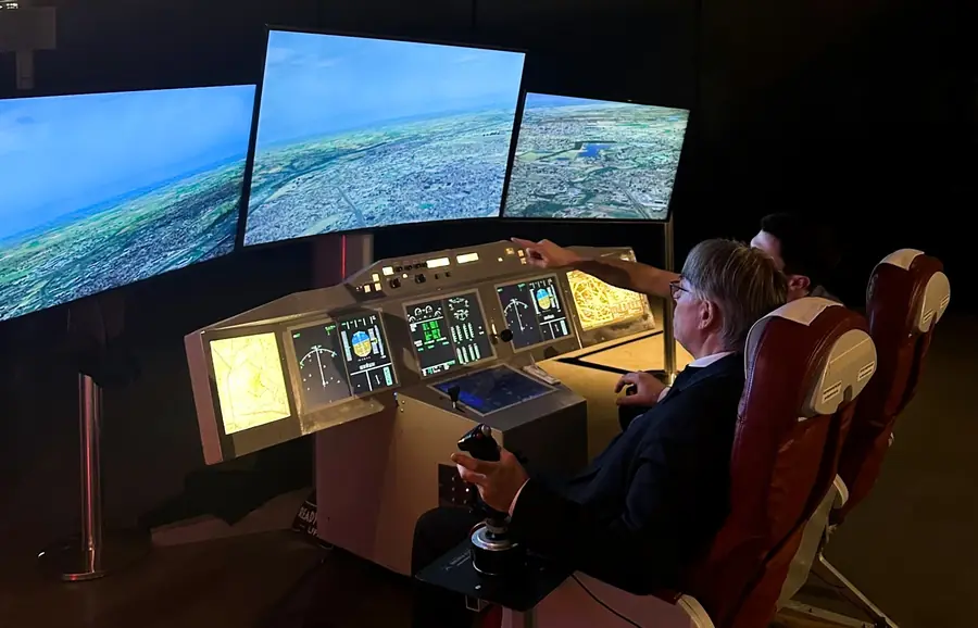 Guest at the controls of the A350 simulator