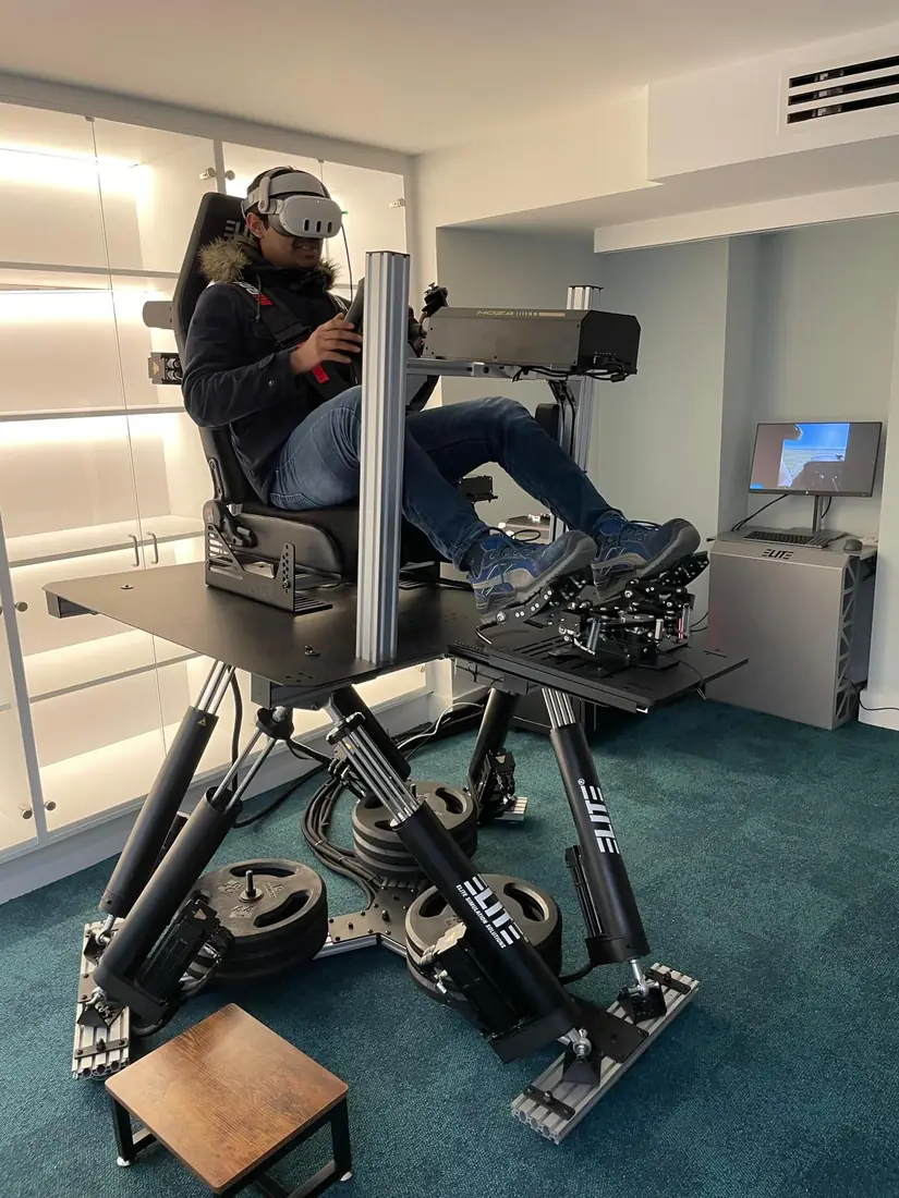 Pilot in VR flying the 6DOF helicopter simulator